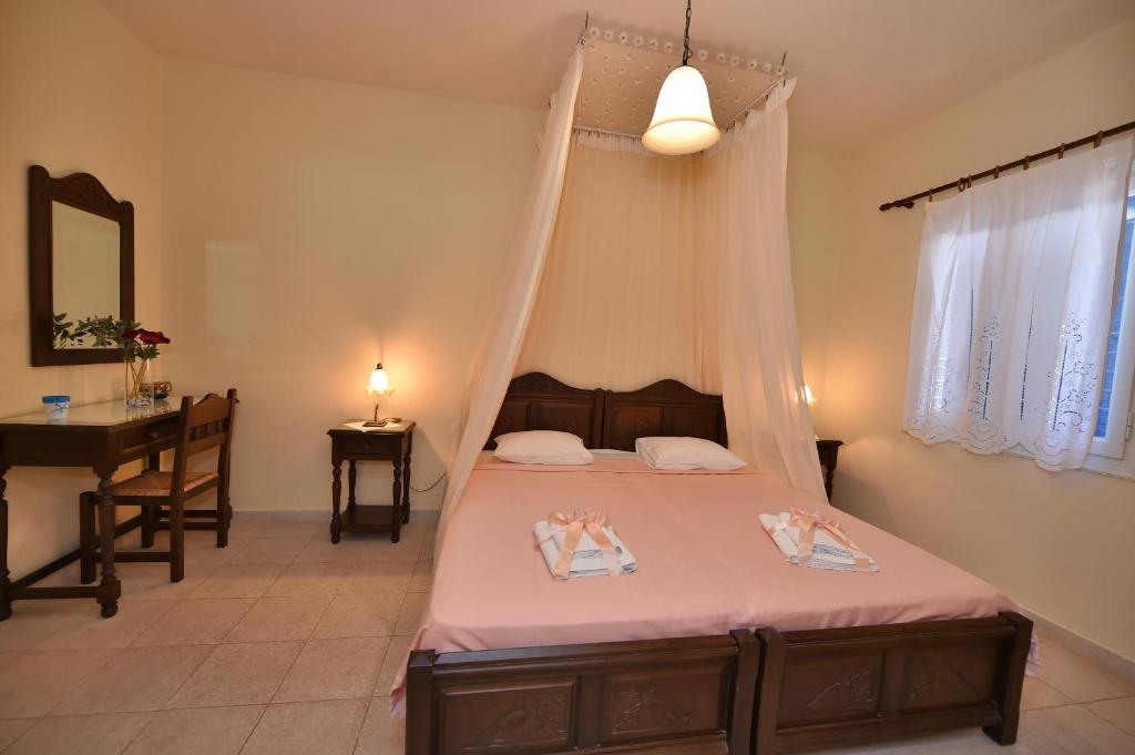 Postel nebo postele na pokoji v ubytování Mata's Apartments