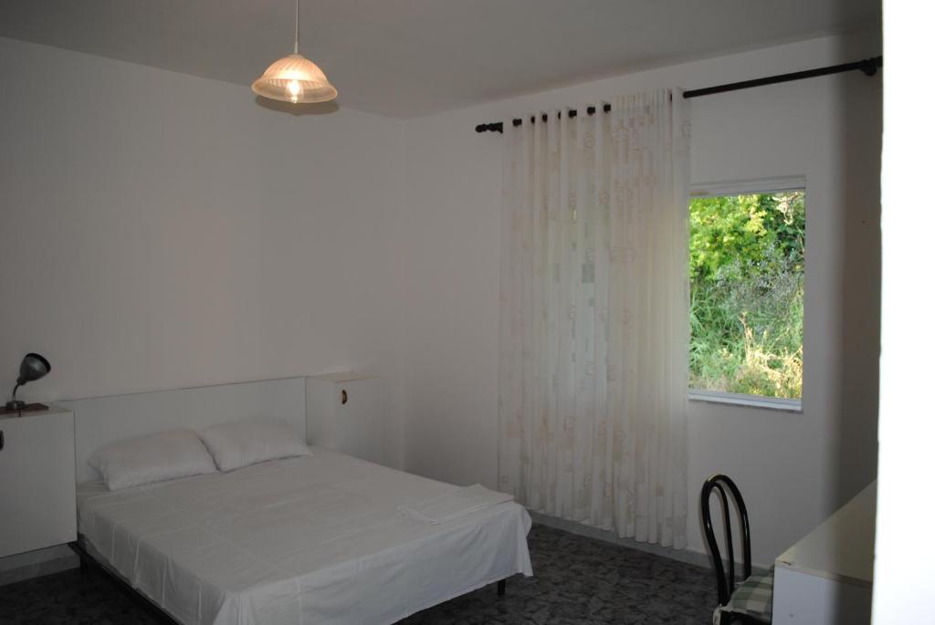 Postel nebo postele na pokoji v ubytování Casa Prifti