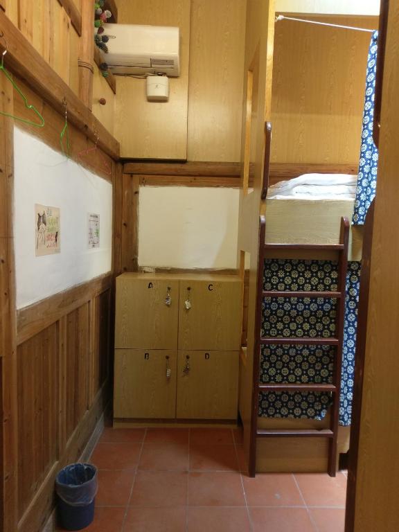 Postel nebo postele na pokoji v ubytování Matsu 1st Hostel