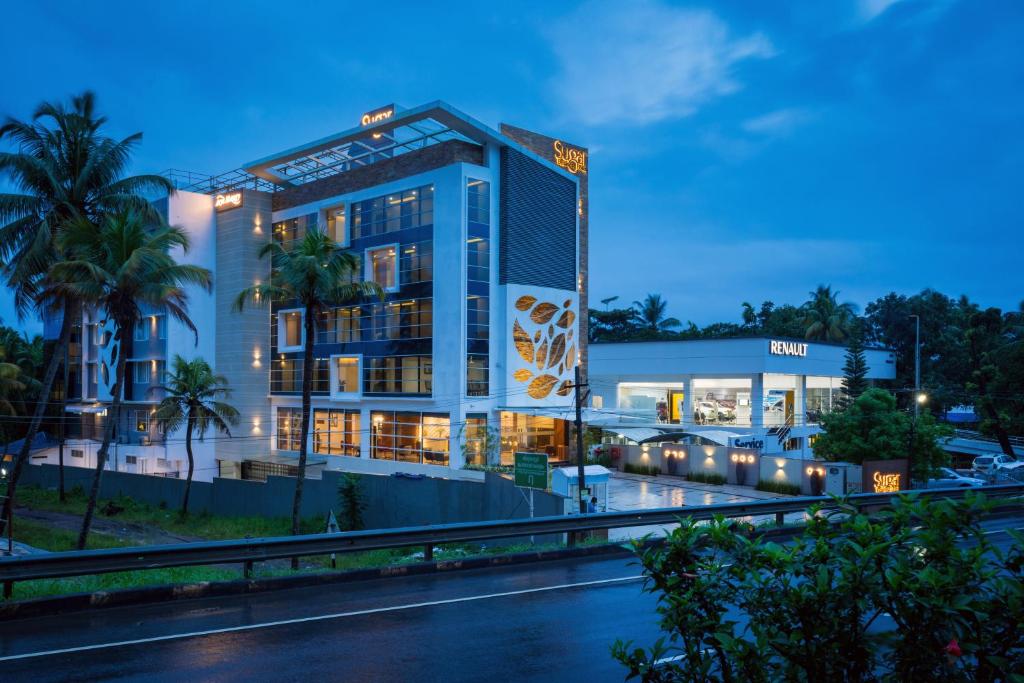 a rendering of a hotel at night at Sugar Business Hotel in Cochin