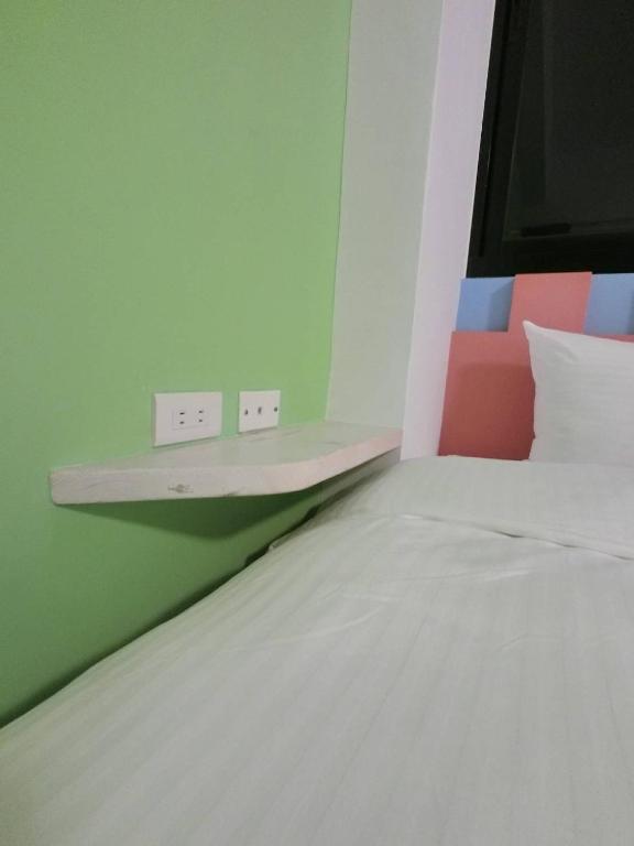 Postel nebo postele na pokoji v ubytování Seven beauties Homestay