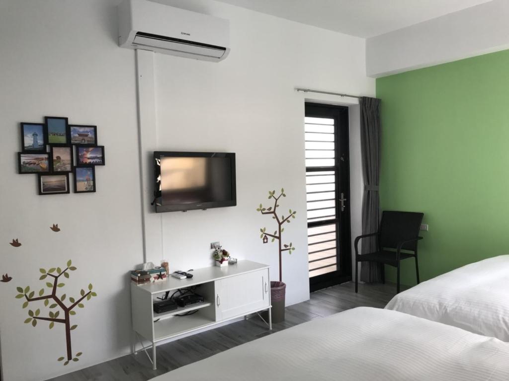 Postel nebo postele na pokoji v ubytování Seven beauties Homestay