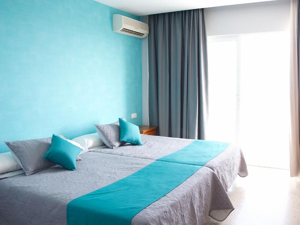 Postel nebo postele na pokoji v ubytování Hotel Salambina