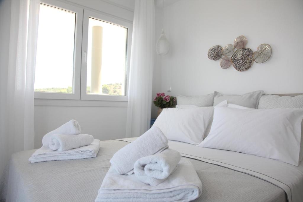 Postel nebo postele na pokoji v ubytování Paliouri Sea Lounge by Luxlikehome