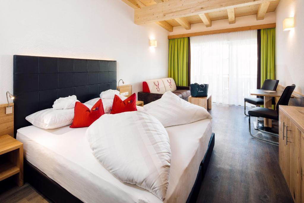 Posteľ alebo postele v izbe v ubytovaní Hotel Sonnleiten
