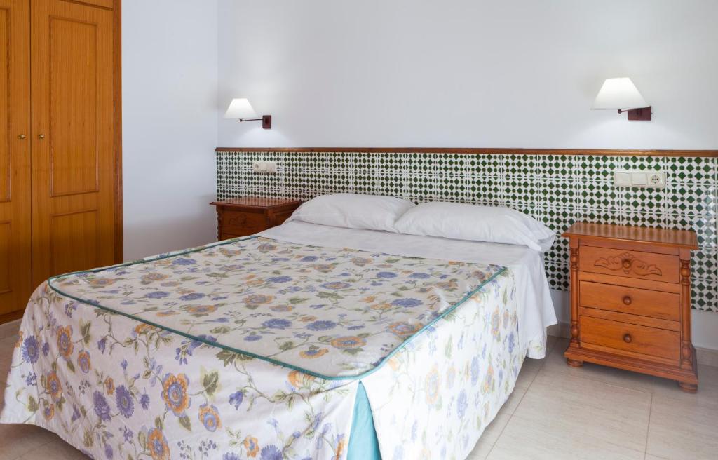 Posteľ alebo postele v izbe v ubytovaní Apartamentos Mexico