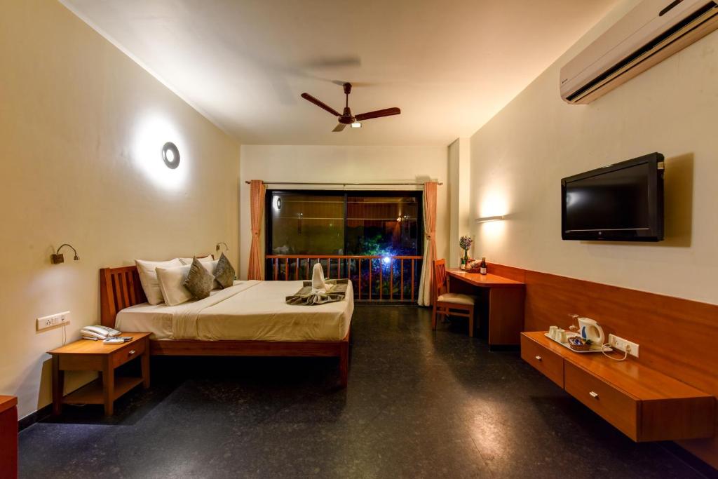 Postel nebo postele na pokoji v ubytování Regenta Resort Soma Vine Village Nashik