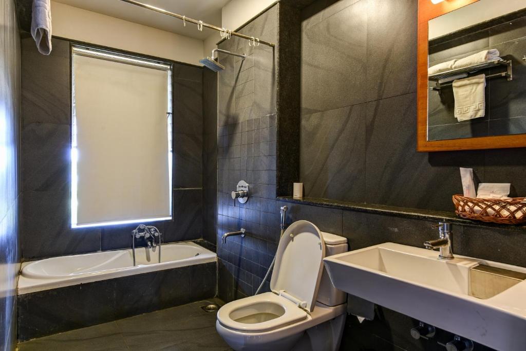 Koupelna v ubytování Regenta Resort Soma Vine Village Nashik