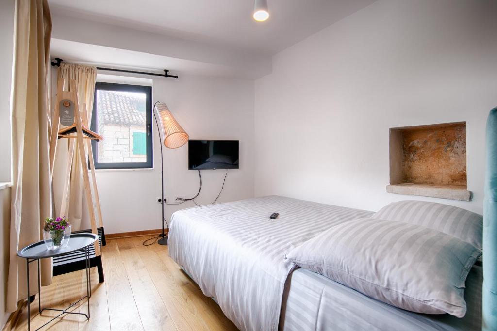 Posteľ alebo postele v izbe v ubytovaní Bella Vista Suites