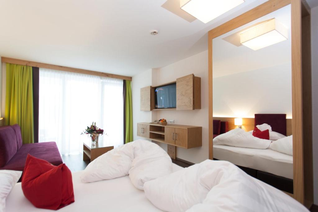 Posteľ alebo postele v izbe v ubytovaní Hotel Sonnleiten
