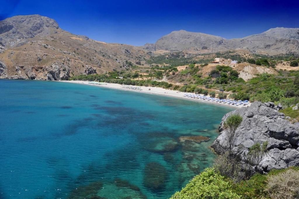 an aerial view of a beach with rocks and water at Creta Spirit in Plakias