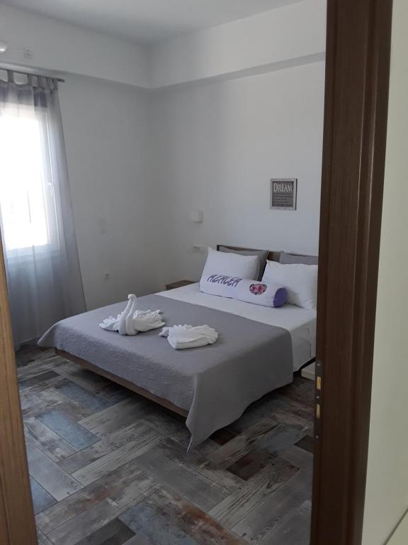 Postel nebo postele na pokoji v ubytování Azalea Hotel