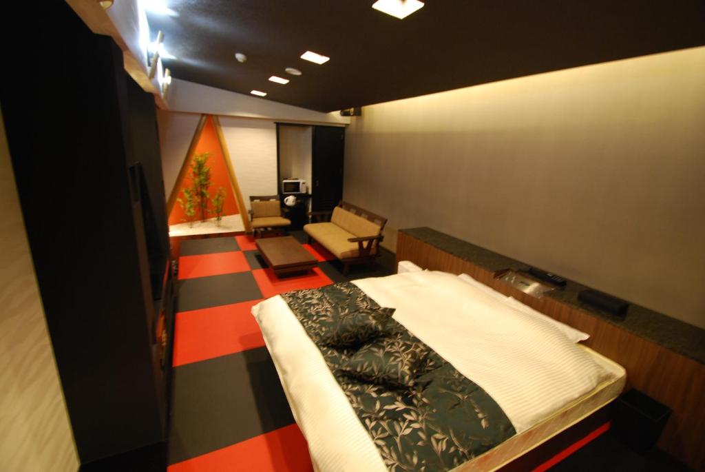 Postel nebo postele na pokoji v ubytování Hotel Free Style Okayama