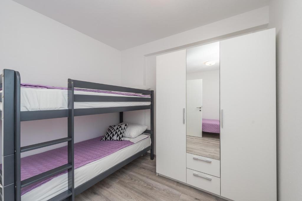 Posteľ alebo postele v izbe v ubytovaní Apartments Janice