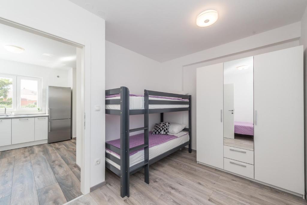 Posteľ alebo postele v izbe v ubytovaní Apartments Janice