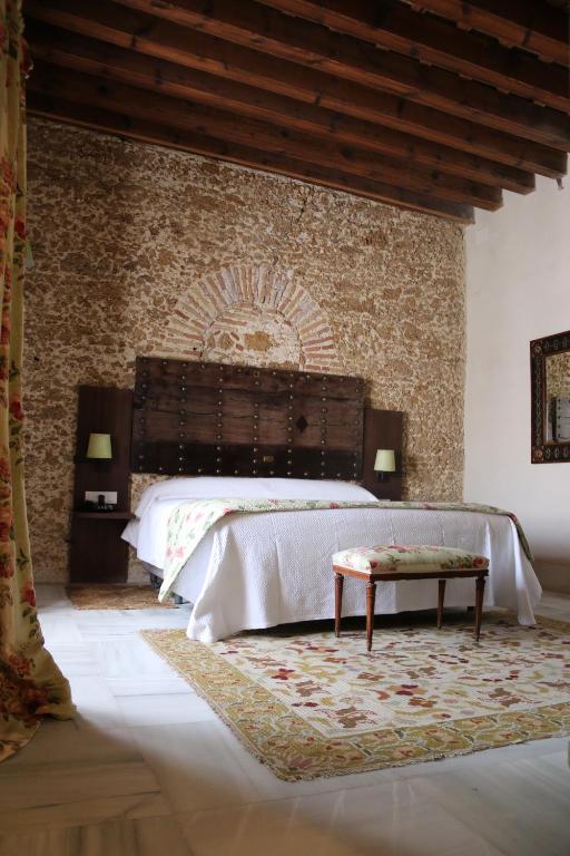 Posteľ alebo postele v izbe v ubytovaní Hotel Casa de las Cuatro Torres