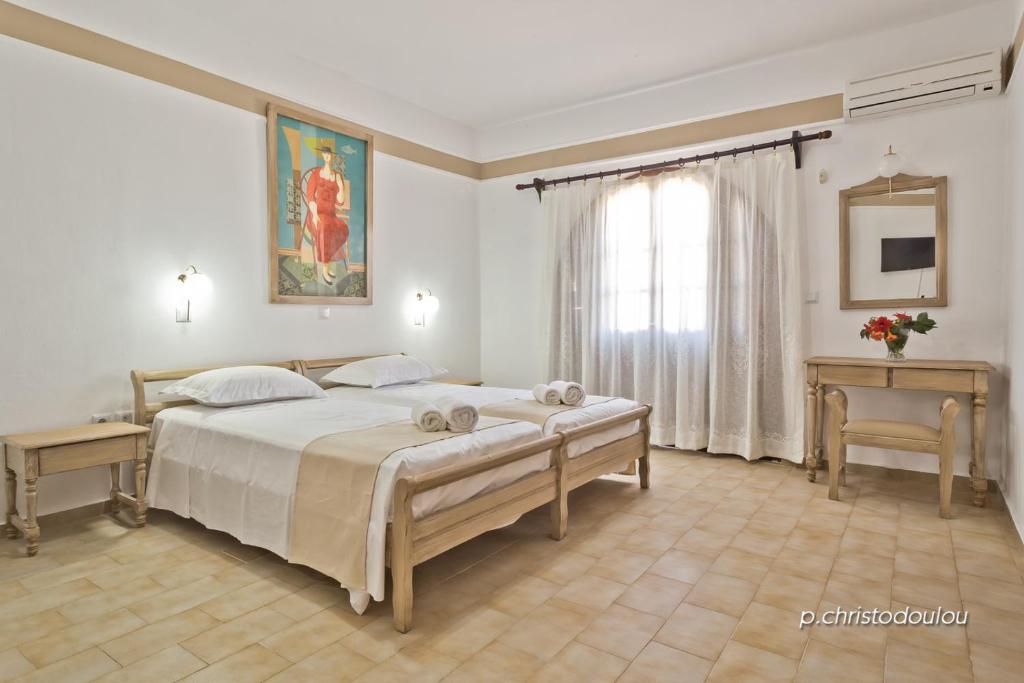 Postel nebo postele na pokoji v ubytování Philoxenia Studios 2
