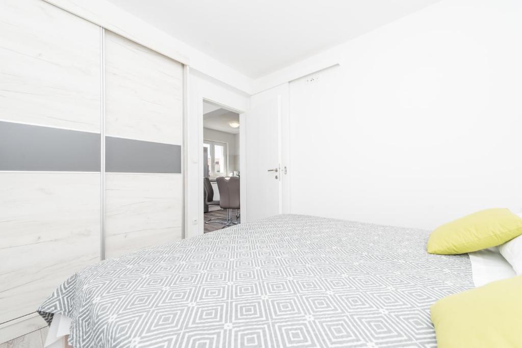 Posteľ alebo postele v izbe v ubytovaní Apartments Janice