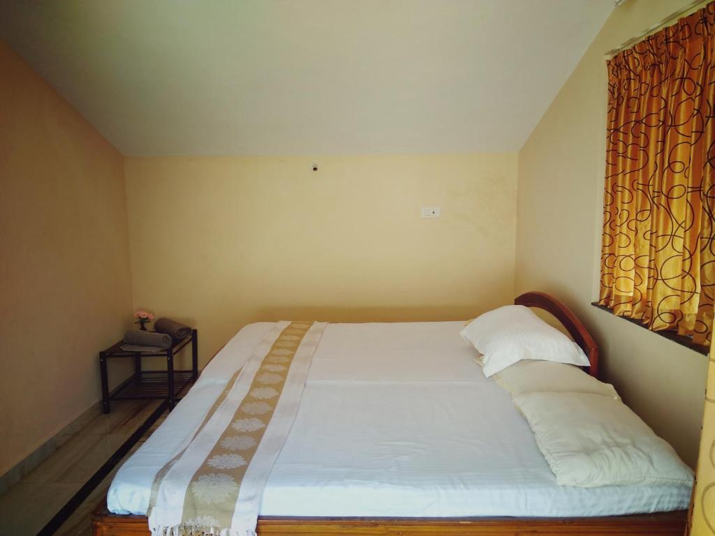 Postel nebo postele na pokoji v ubytování Menezes House