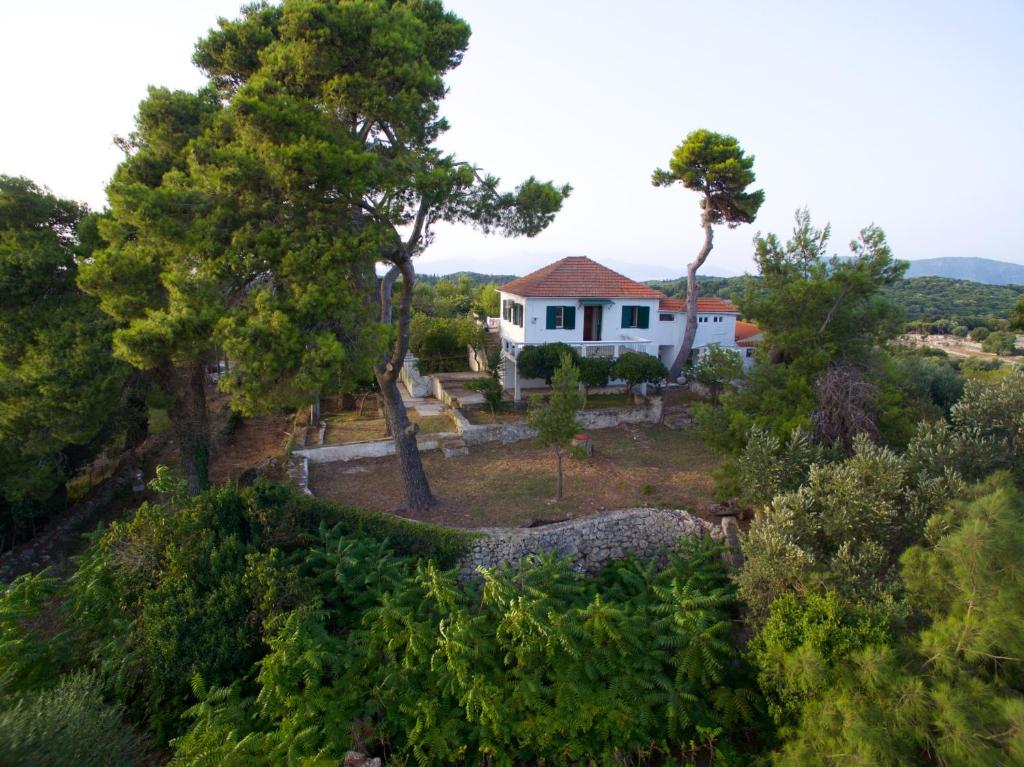 an aerial view of a white house with trees at Villa eleni in Kothréas