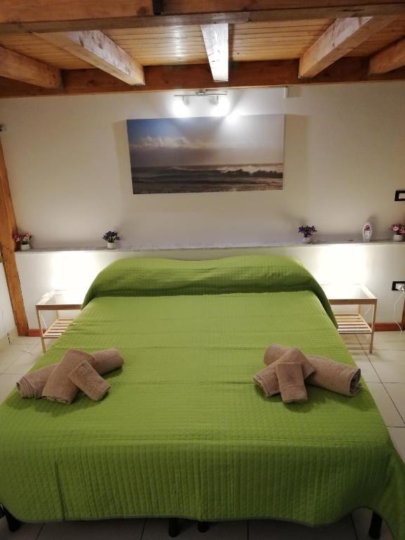 Łóżko lub łóżka w pokoju w obiekcie Dimora 394