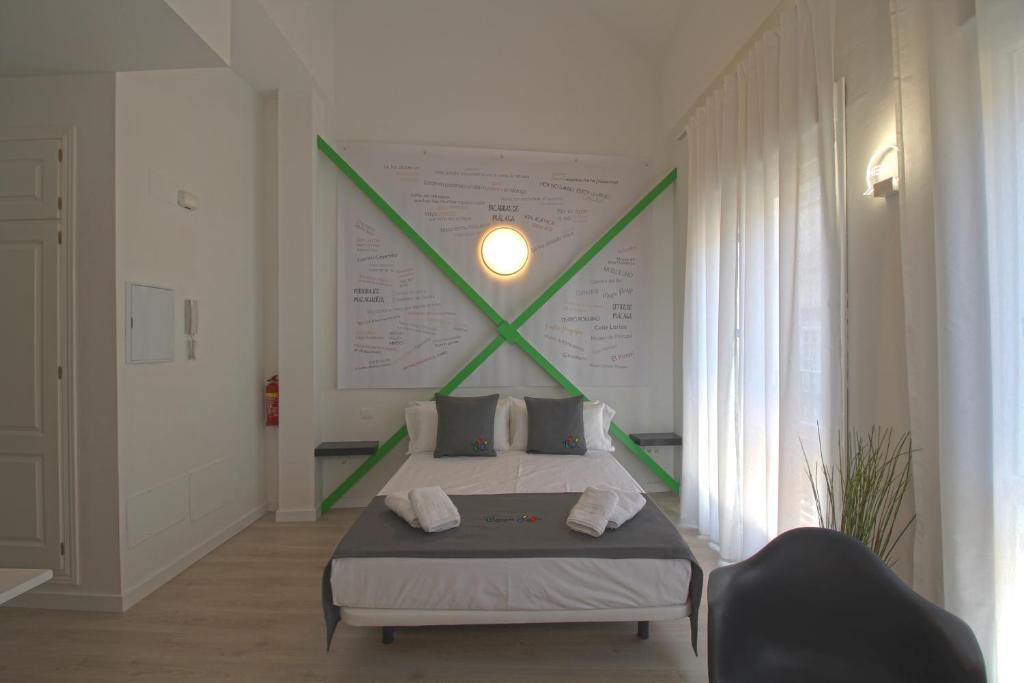 Posteľ alebo postele v izbe v ubytovaní Apartamentos Romero Luna