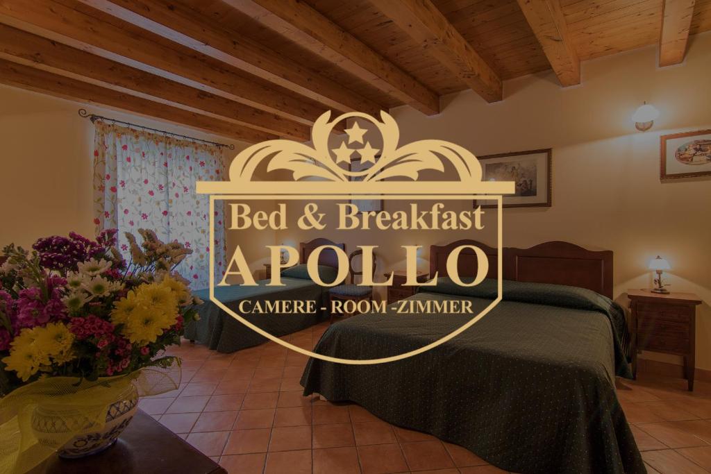 A bed or beds in a room at Apollo B&B