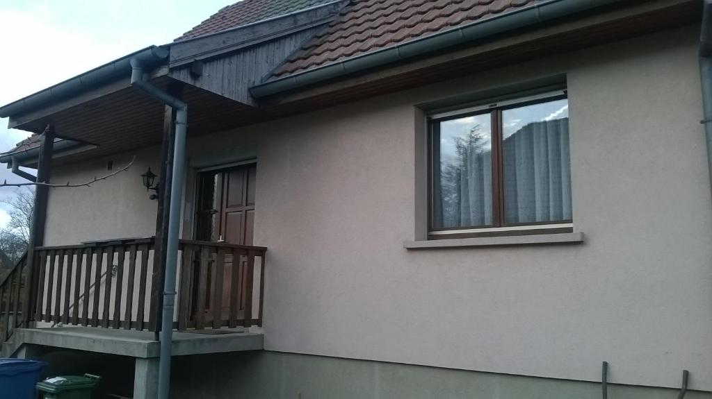 a house with a balcony and a window at alsacecoeur in Ungersheim