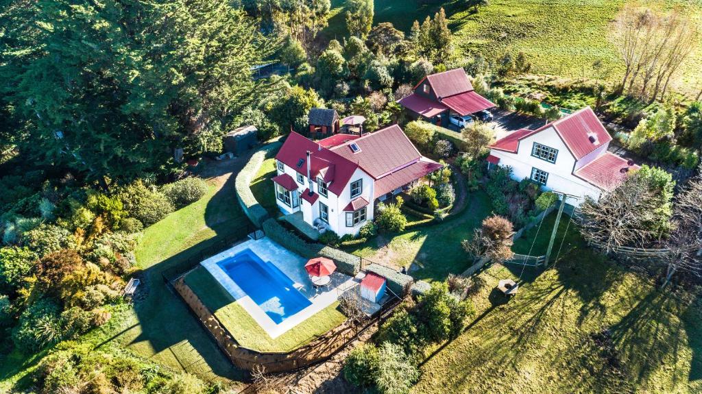 an aerial view of a house with a swimming pool at Twin Gullies in Akaroa