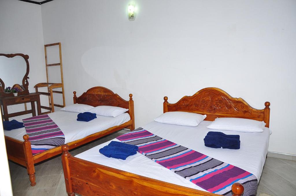 Postel nebo postele na pokoji v ubytování Mother House