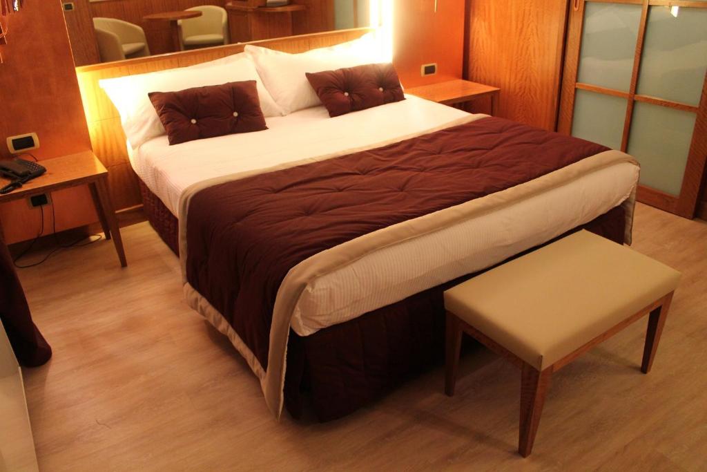 Postel nebo postele na pokoji v ubytování Hotel Motel Futura