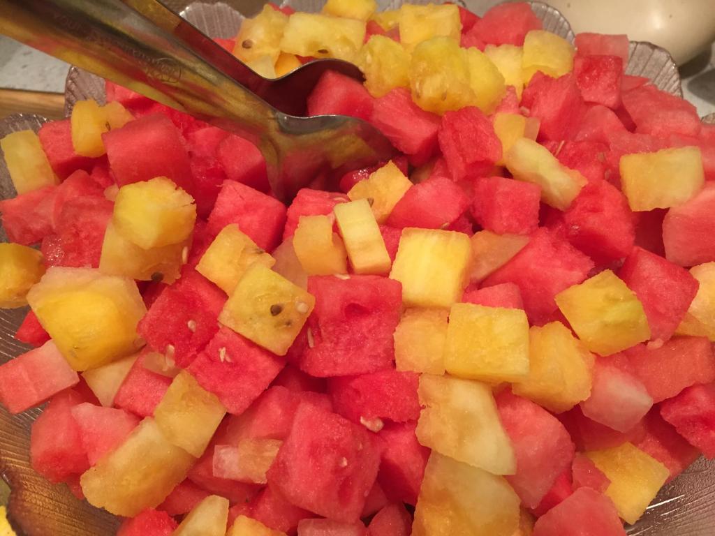 a bowl of diced fruit with a spoon in it at Hotel Styrolerhof in Steeg