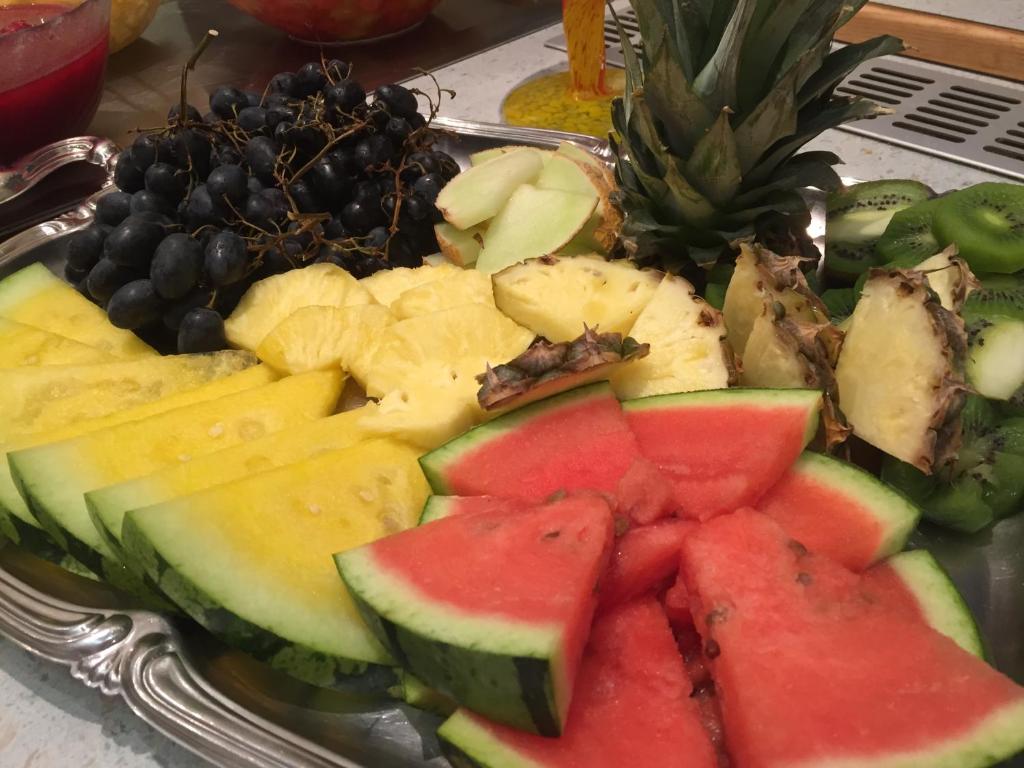 a tray of fruits and vegetables on a table at Hotel Styrolerhof in Steeg