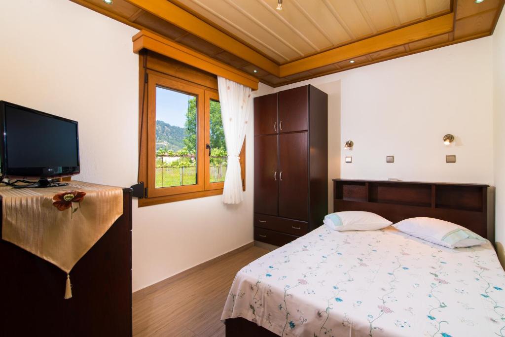Posteľ alebo postele v izbe v ubytovaní Semiramis Cottage