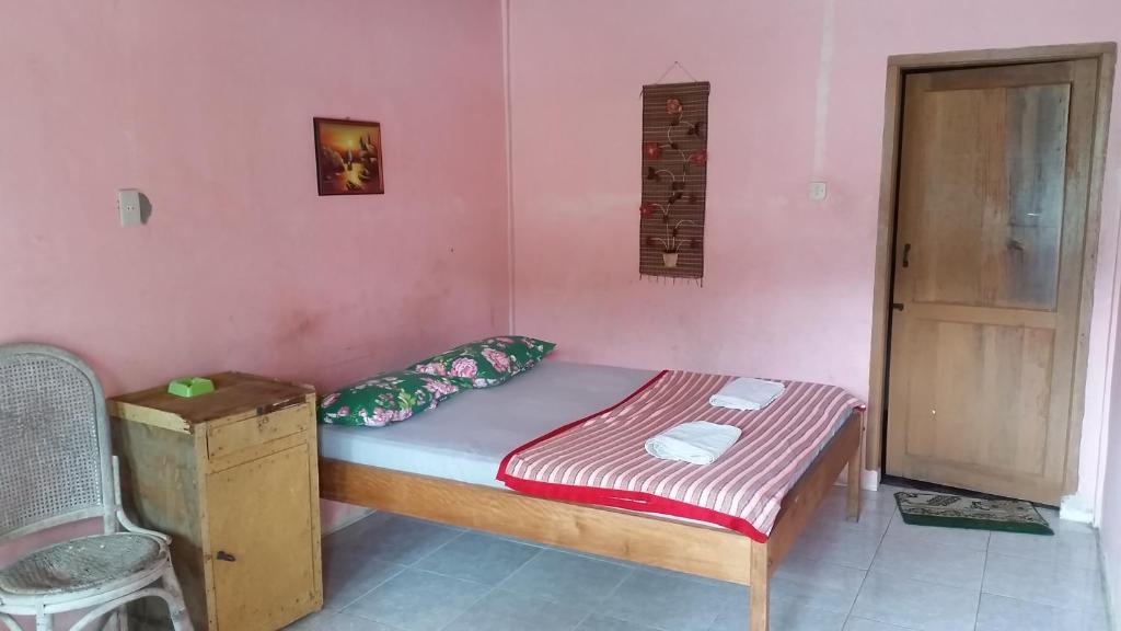 Postel nebo postele na pokoji v ubytování Sibayak Guesthouse