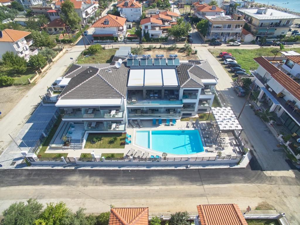 an aerial view of a house with a swimming pool at Albatros Suites in Nea Vrasna