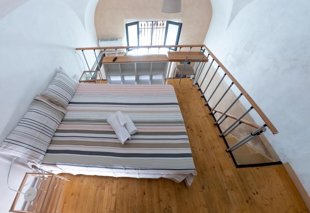 A bed or beds in a room at Casa della Palma