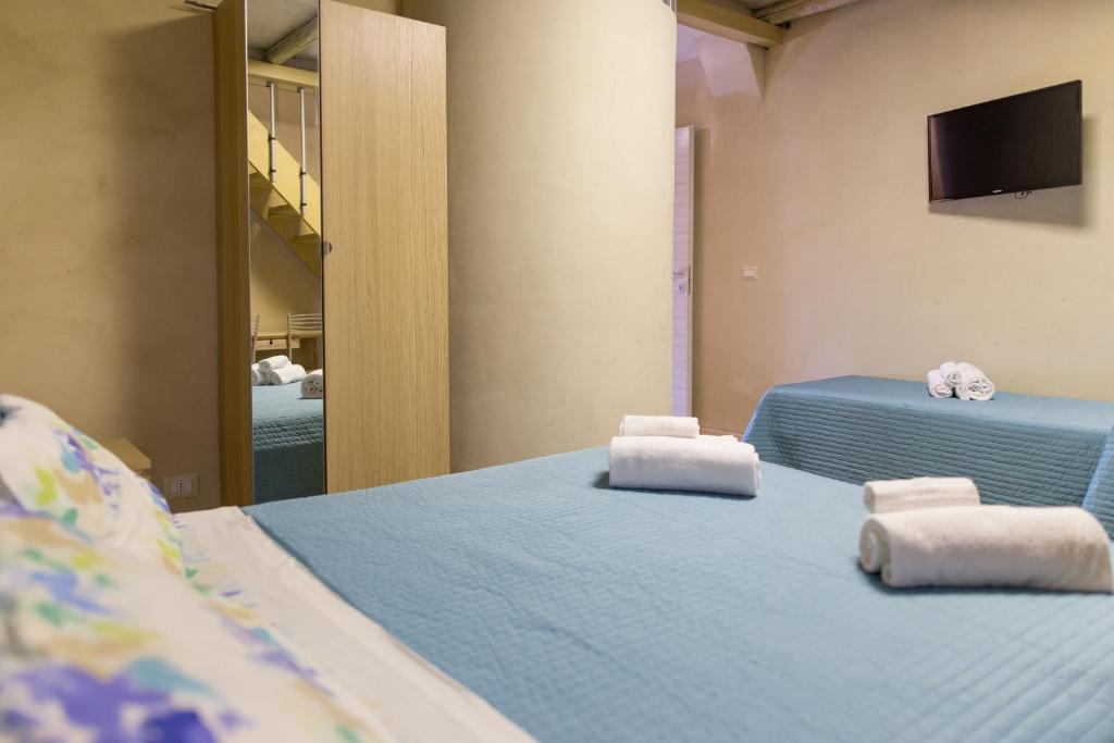 A bed or beds in a room at Casa della Palma