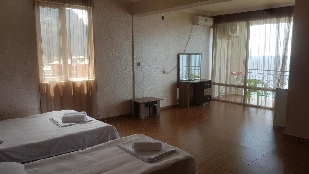 Postel nebo postele na pokoji v ubytování Hotel Kvariati Nugo