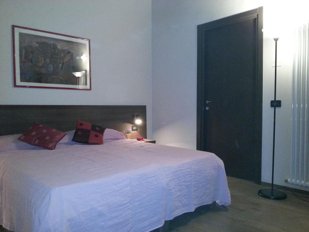 Łóżko lub łóżka w pokoju w obiekcie Hotel La Vecchia Reggio