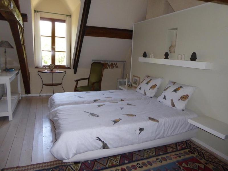 Postel nebo postele na pokoji v ubytování Chambres d'Hotes à La Chandelle