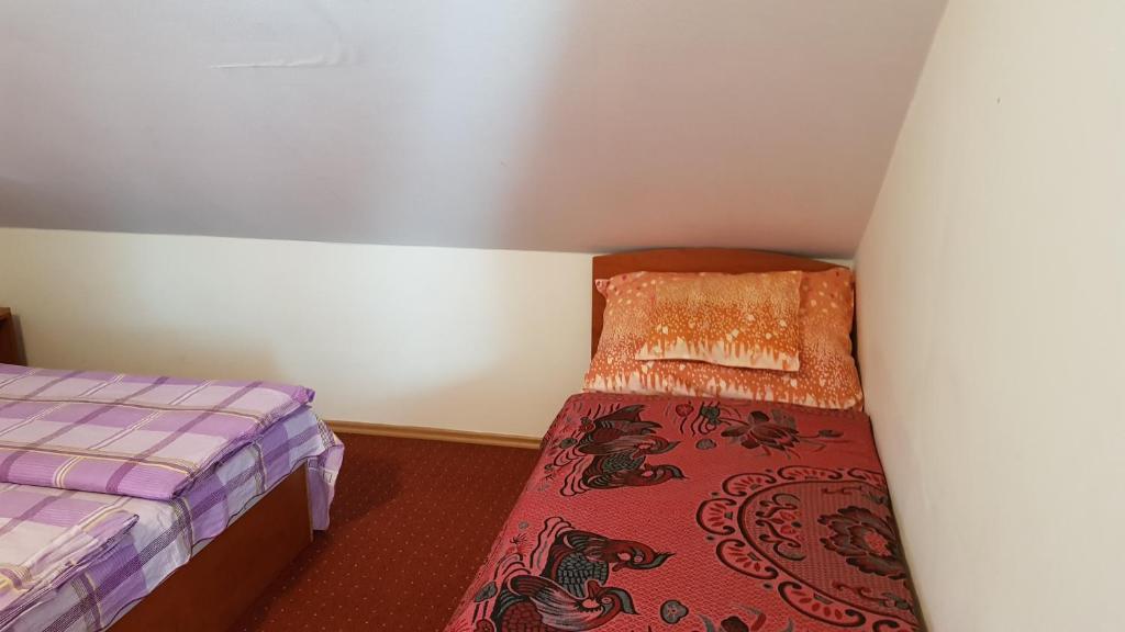 Postel nebo postele na pokoji v ubytování Mészöly Vendégház