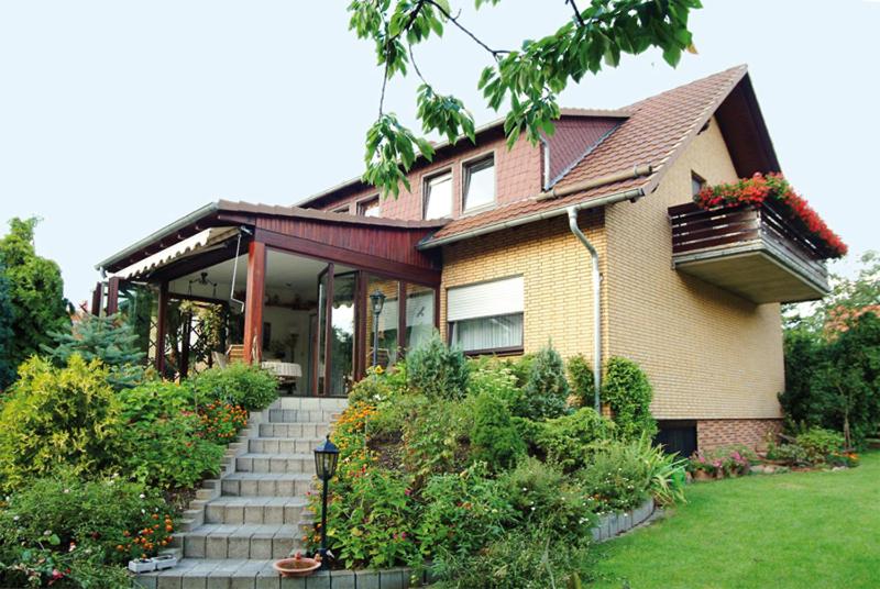 a house with a staircase in front of it at Ferienwohnung Koch in Bad Grund