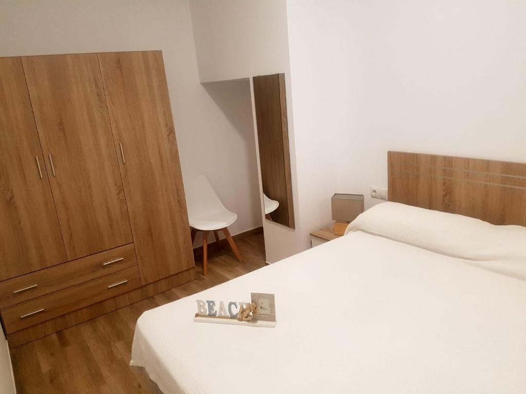 Postel nebo postele na pokoji v ubytování Apartments Naty Beach
