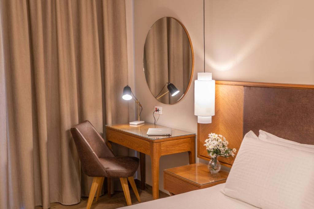 Postel nebo postele na pokoji v ubytování Achilles Hill Hotel
