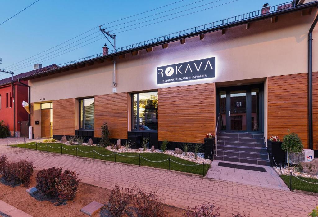 a building with a sign on the front of it at Rokava in Rohatec