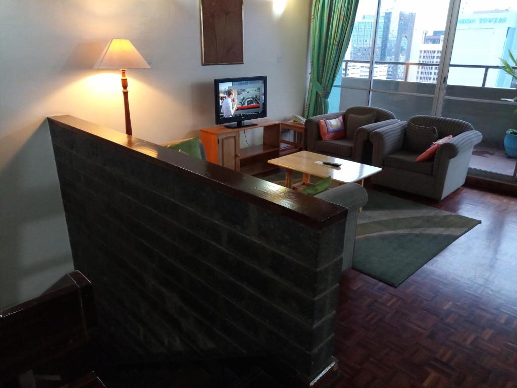 TV a/nebo společenská místnost v ubytování Chester Hotel and Suites Nairobi, City Centre CBD