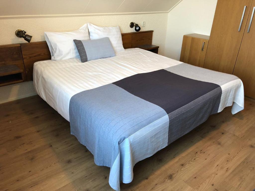 Postel nebo postele na pokoji v ubytování DuinHotel Texel