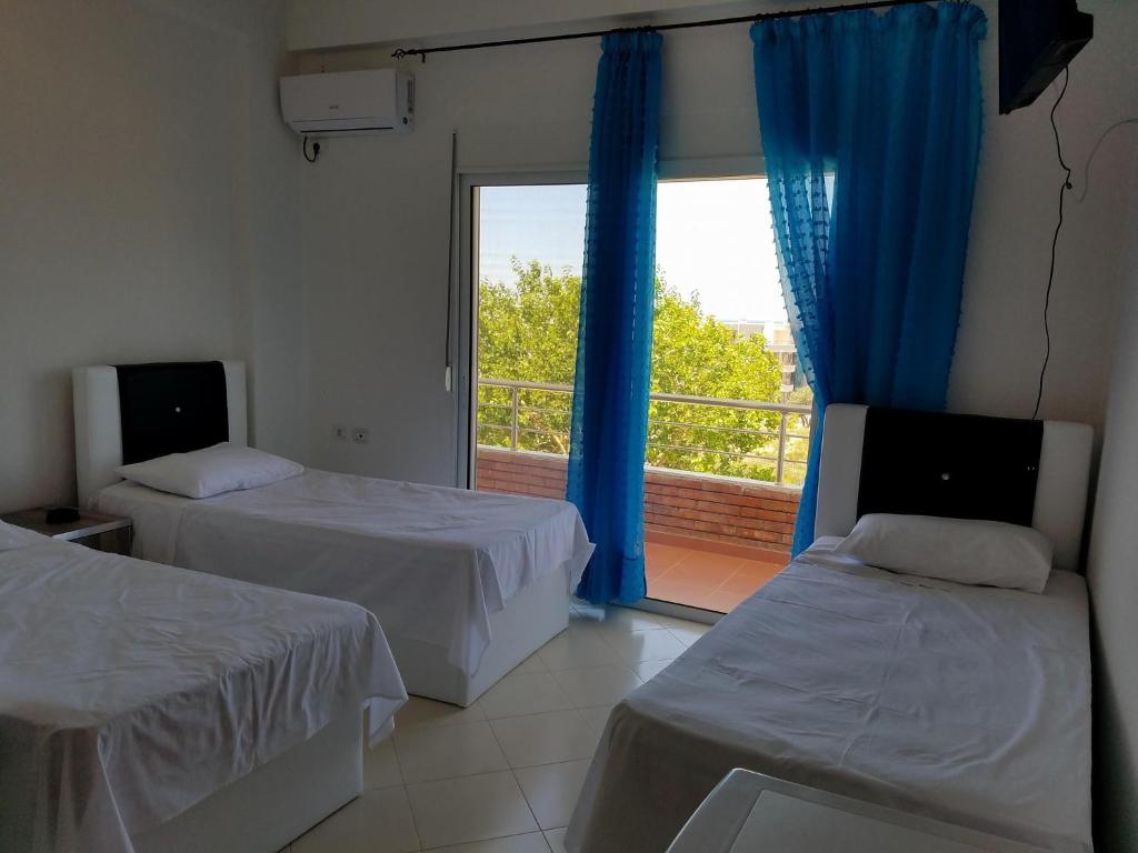Postel nebo postele na pokoji v ubytování Sunset Hotel Roza