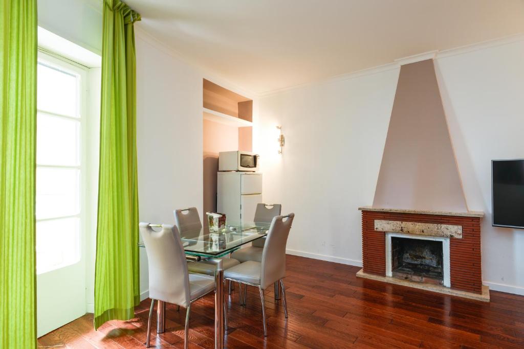 Televízia a/alebo spoločenská miestnosť v ubytovaní Archimede Flat